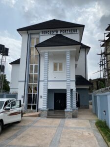 One building and a car